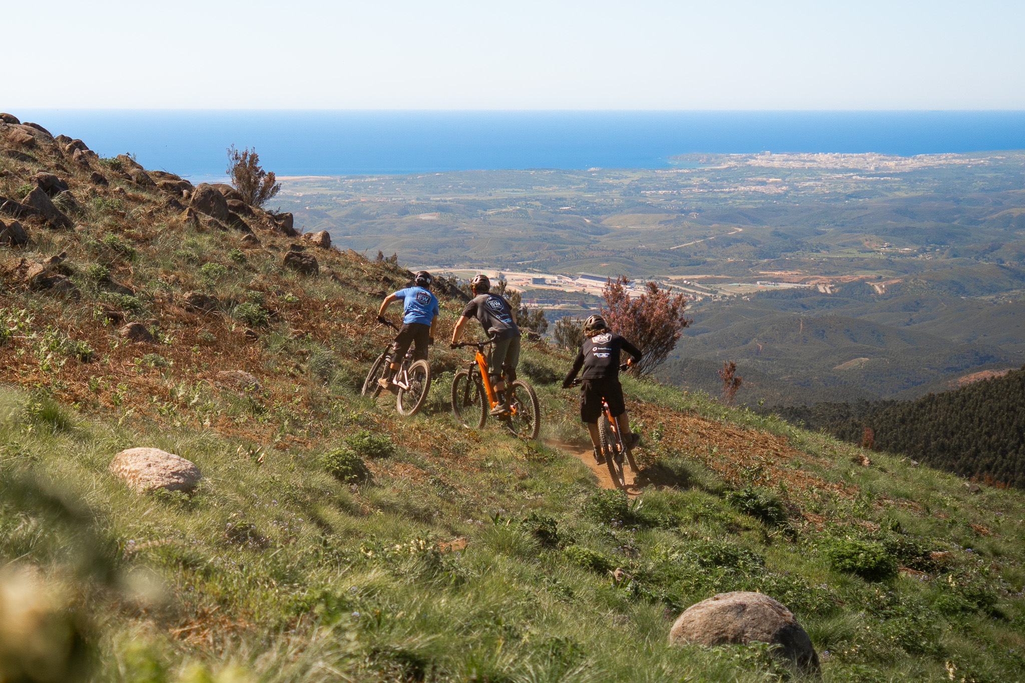 Mountain bike route descending from highland trails to the coast in Algarve